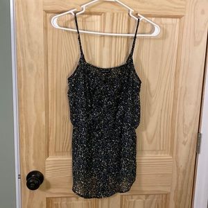 Sheer flowy spaghetti strap summery top.  Very flattering